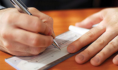 Man writing out a cheque